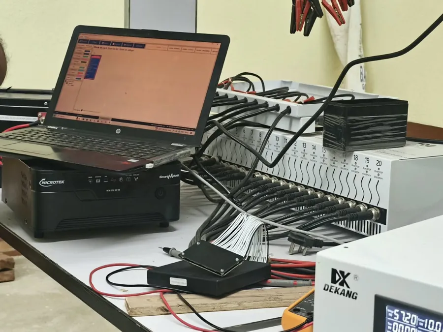 Laptop and BMS programming leads on the assembly bench